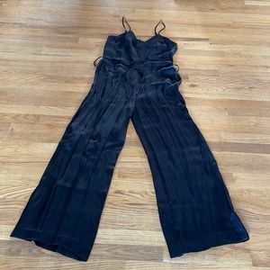 Shiny black romper - size 12. NWT
